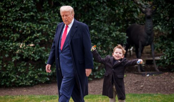 President Donald Trump and X Æ A-Xii, the son of White House Senior Advisor, Tesla and SpaceX CEO Elon Musk, walks toward Marine One on the South Lawn on March 14, 2025, in Washington, D.C.