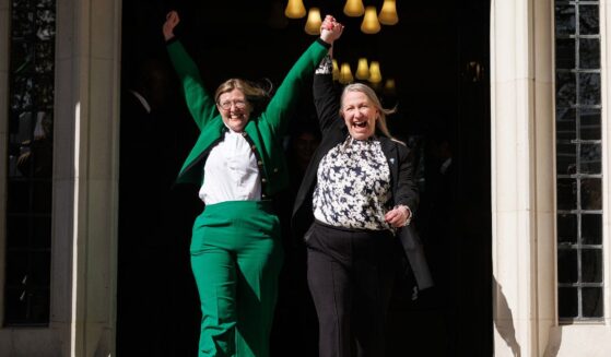 Susan Smith, left, and Marion Calder, right, directors of "For Women Scotland" cheer as they leave the Supreme Court in London, England, on Wednesday.