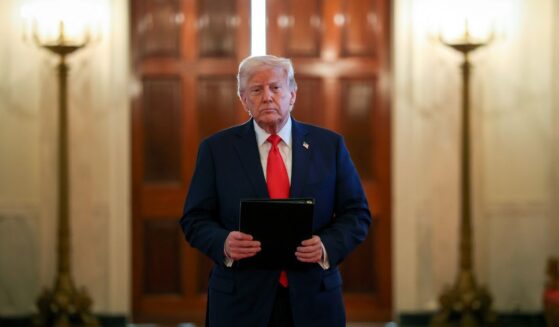 U.S. President Donald Trump arrives for a presentation ceremony for the Commander-in-Chief Trophy to the U.S. Naval Academy in the East Room of the White House on April 15, 2025 in Washington, DC.